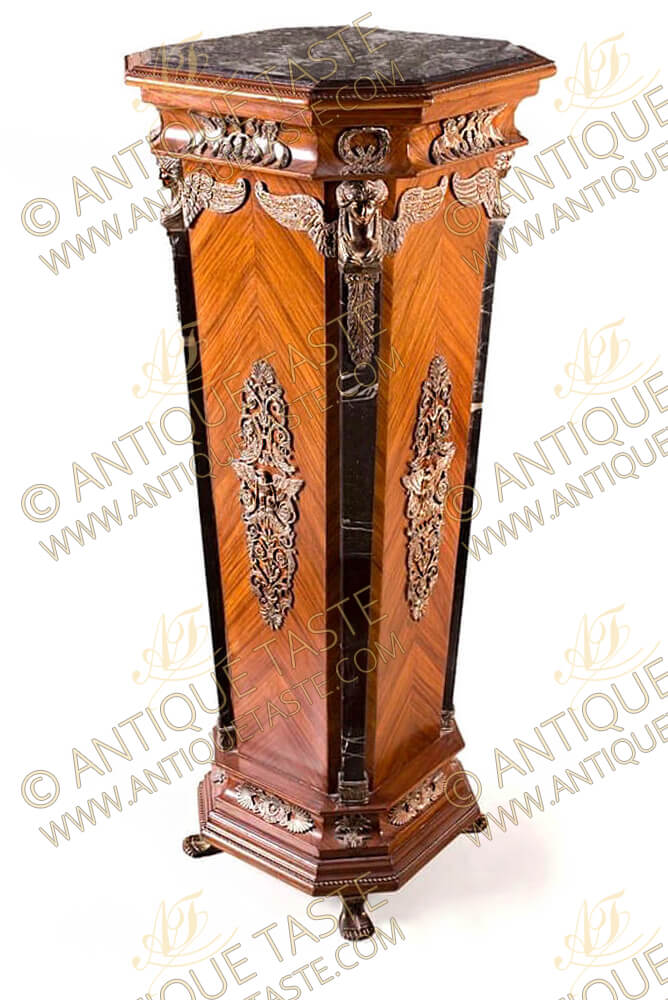 Empire-style Ormolu-mounted Marble-top light sans traverse palisander Veneer inlaid Pedestal, on the manner of 19th century, the square veined black marble top with canted corners, over a conforming tapered base with further veined black marble columns headed with fine chiseled exquisite ormolu Sphinx-form capitals, with Neoclassical-style mounts throughout, raised on four feet-form feet